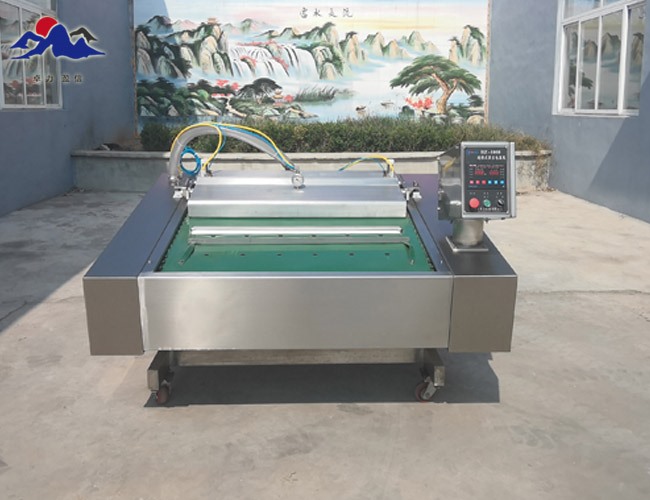 連續(xù)滾動式真空包裝機?